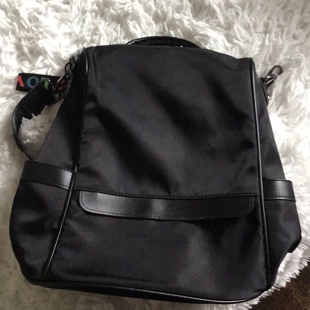 Black book bag with the zipper on the inside